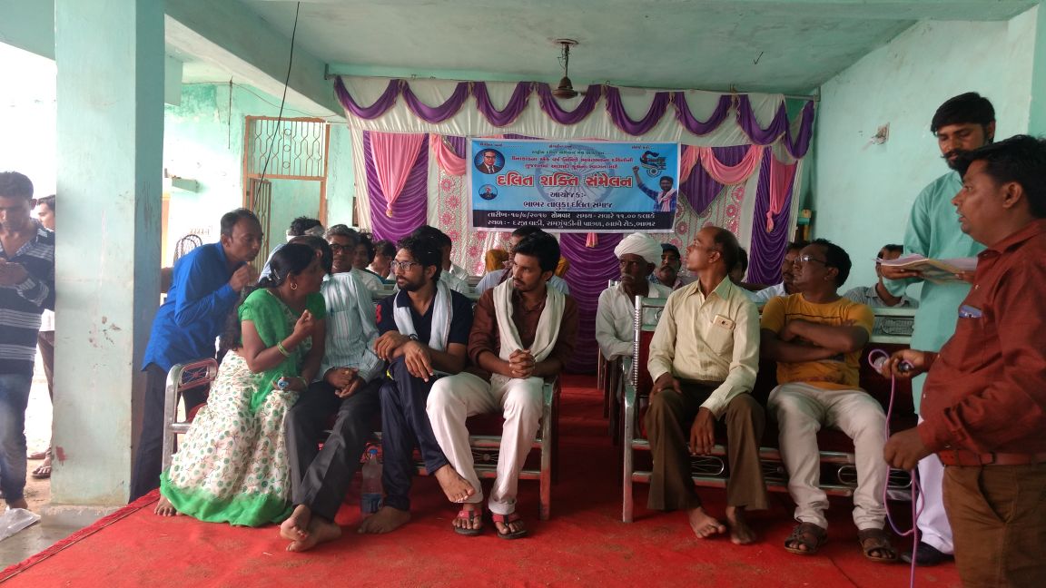 Laxmiben (left, green sari) along with Jignesh Mevani and core team member Subodh Parmar during a public Azadi Kooch meeting.