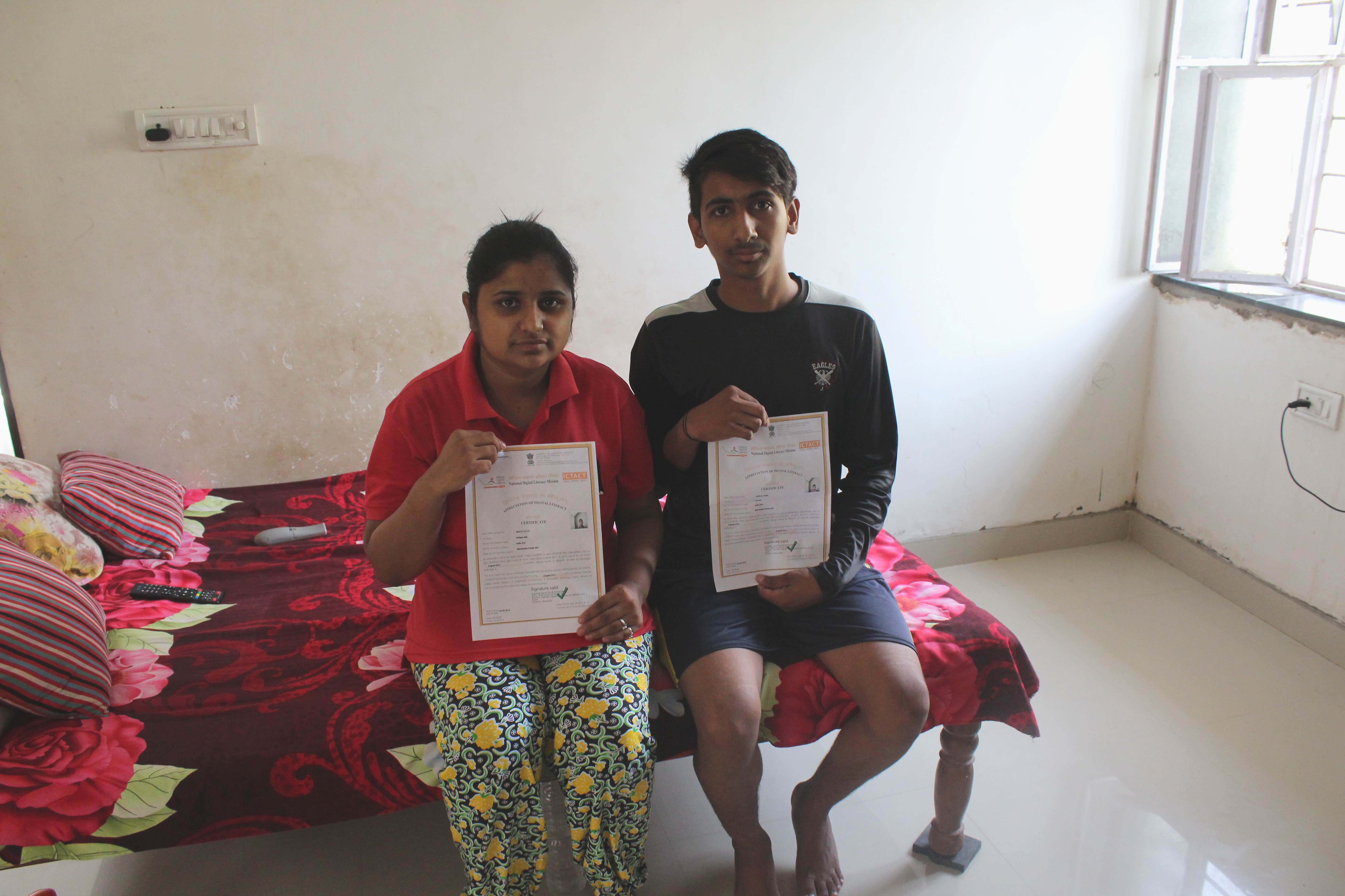 Shubham and his sister holding the digital literate certificate under NDLM. Credi: Shruti Jsin