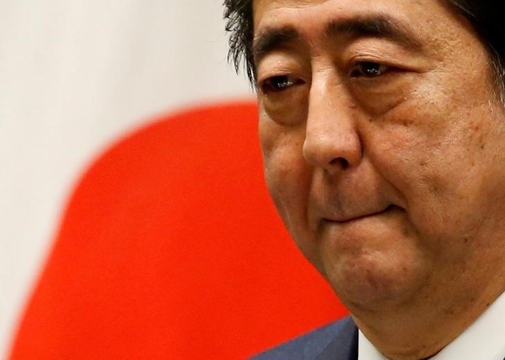 japanese pm abe urges g20 to work together on climate protection