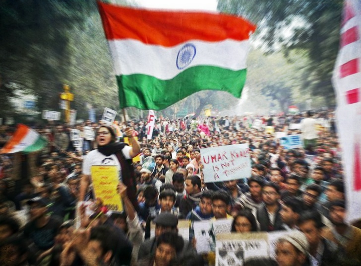 A demonstrator shouts slogans and waves the Indian national flag as she takes part in a protest demanding the release of Kanhaiya Kumar, a Jawaharlal Nehru University (JNU) student union leader accused of sedition, in New Delhi, India, February 18, 2016. REUTERS/Anindito Mukherjee