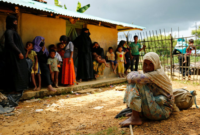 New Rohingya refugees sit near the Kutupalang makeshift refugee camp, in Cox's Bazar, Bangladesh, August 29, 2017. Credit:Reuters