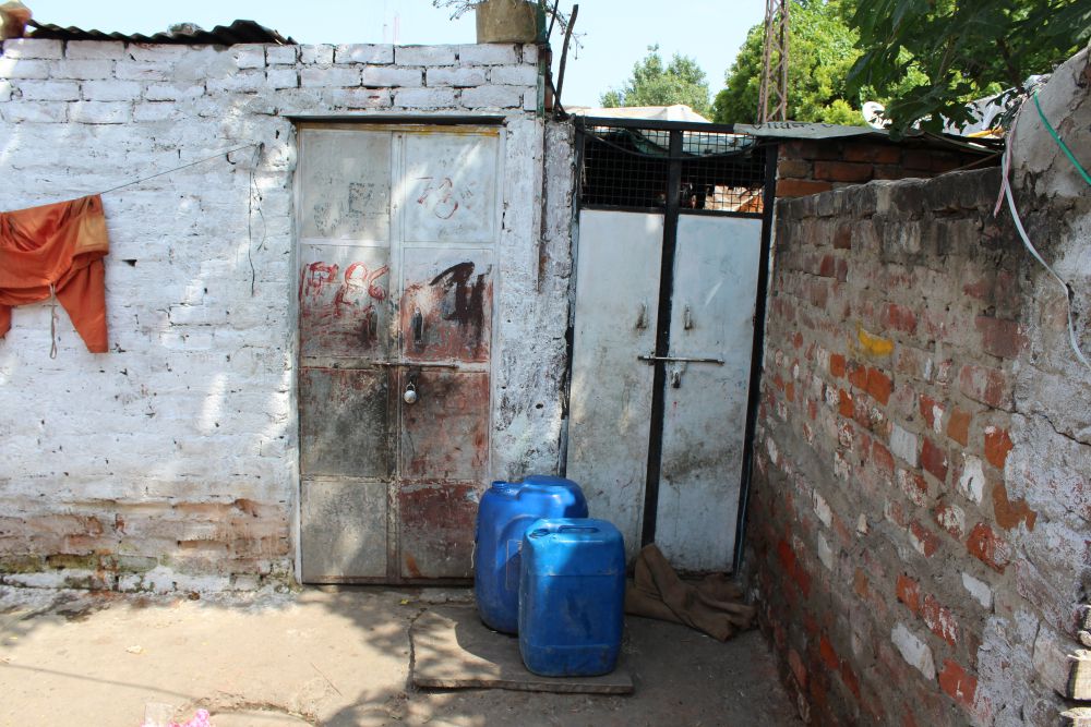 Locked homes of the Rohingya refugees in Rajeev Nagar who left their homes after police intimidation. Credit: Shruti Jain