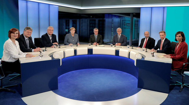 Party leaders, Katja Kipping, Joerg Meuthen, Joachim Herrmann, Chancellor Angela Merkel, TV host Rainald Becker, host Peter Frey, Martin Schulz, Christian Lindner and Katrin Goering-Eckardt attend a TV chat show in Berlin, Germany, September 24, 2017. Credit: Reuters