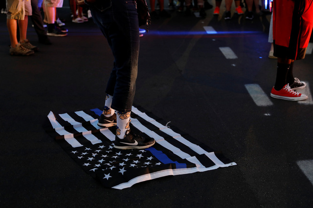 A protester stands on a