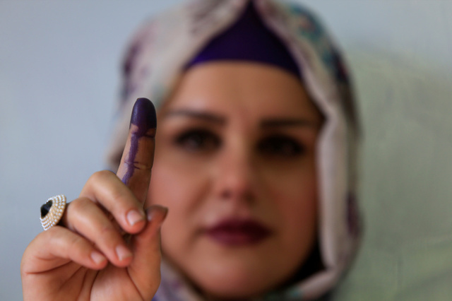 A woman shows her ink-stained finger during Kurds independence referendum in Halabja, Iraq. Credit: Reuters