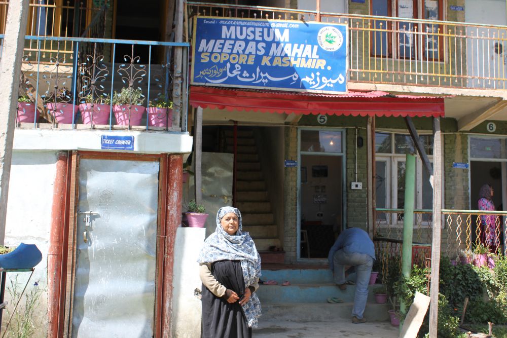 Atika Bano standing outside the Meraas Mahal museum in Sopore. Credit: Bhavneet Kaur