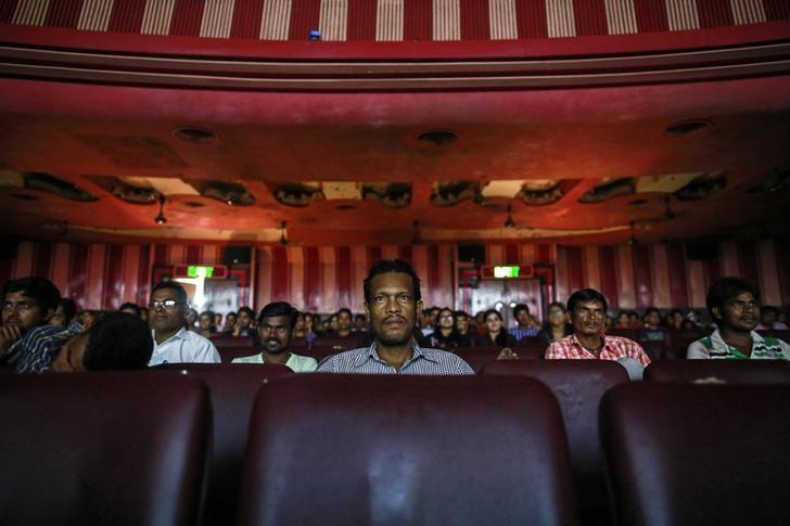Cinema goers watch a Bollywood movie inside Maratha Mandir theatre in Mumbai December 11, 2014. Credit: Reuters/Danish Siddiqui/Files