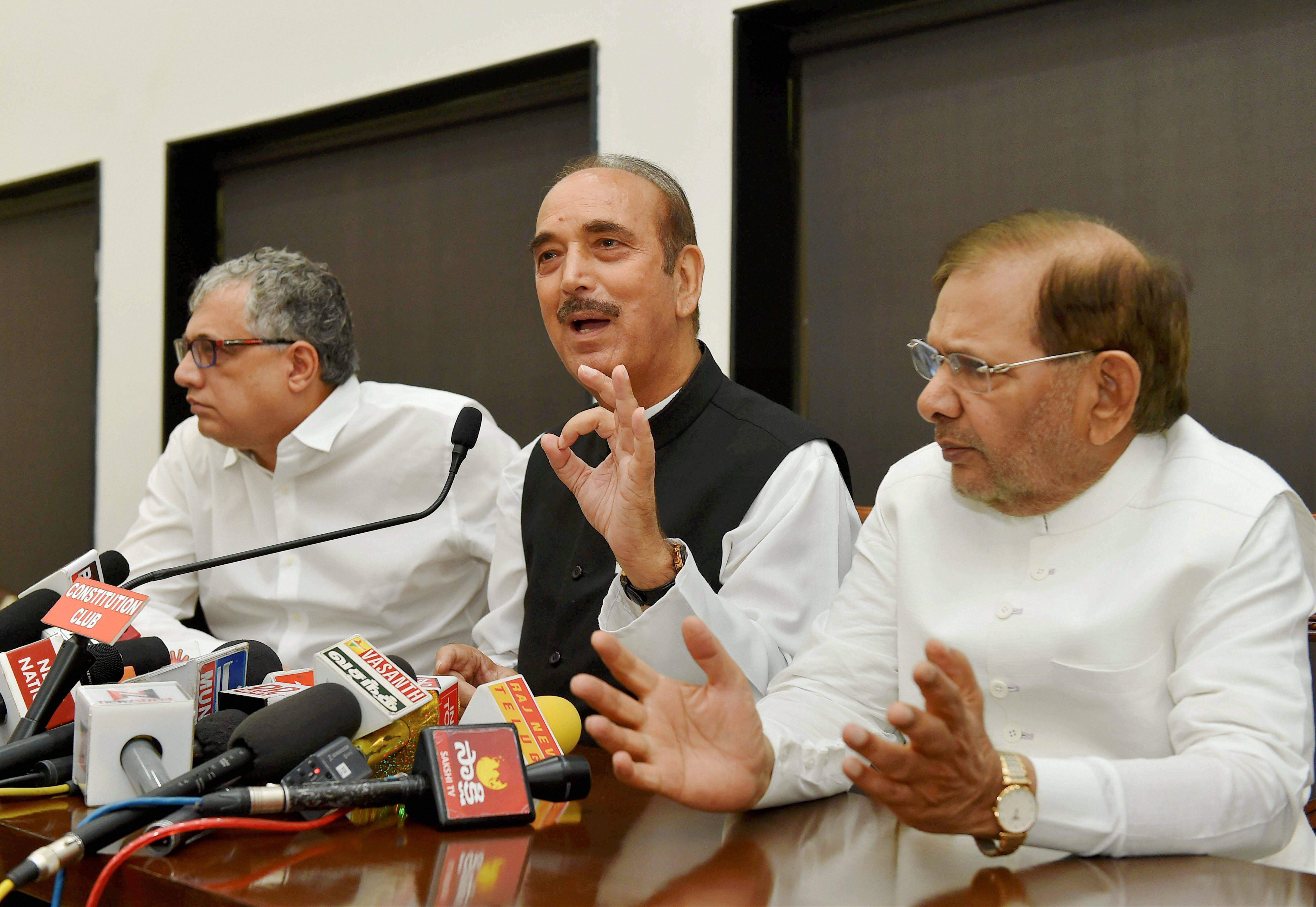 Opposition leaders Ghulam Nabi Azad of Congress, Derek O'Brien of TMC and JD(U) rebel leader Sharad Yadav at a press conference to observe November 8 as Black Day to protest note ban in New Delhi on Tuesday. Credit: PTI