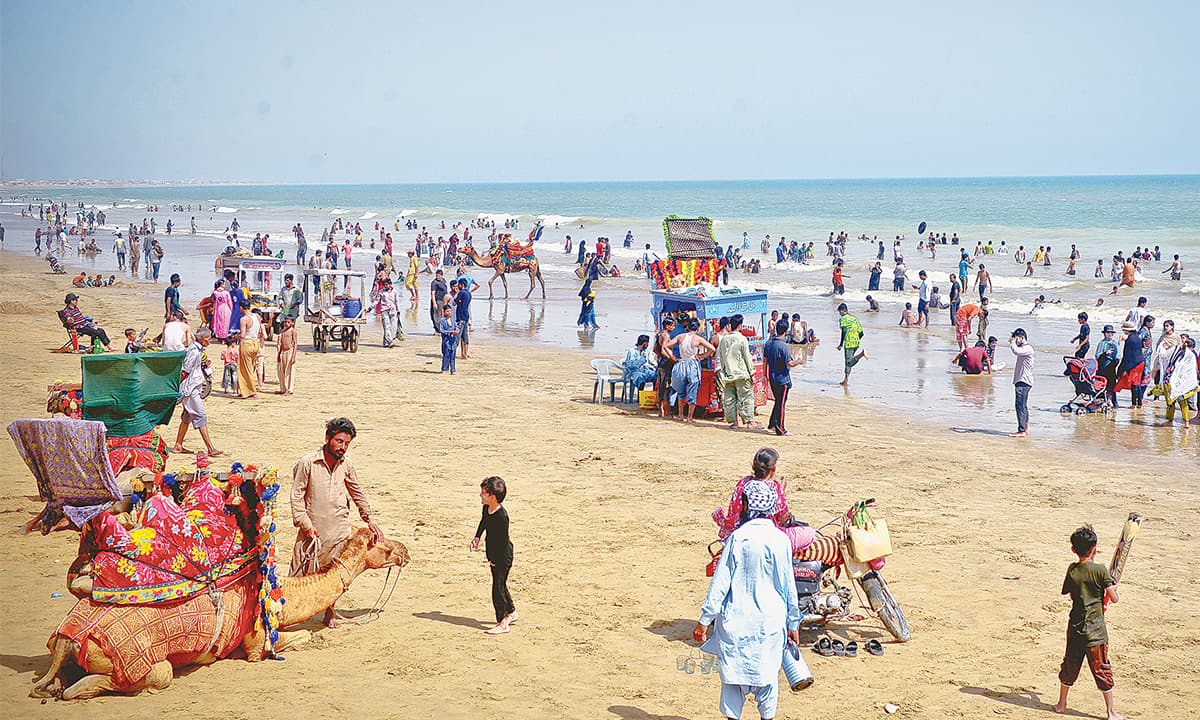 Visitors throng Hawke’s Bay beach in Karachi. Credit: Fahim Siddiqui, White Star