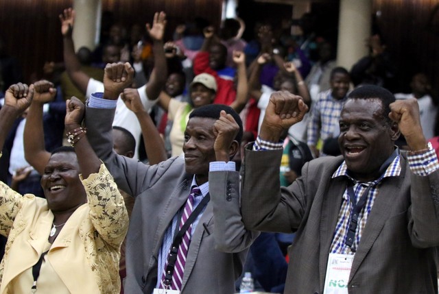 Delegates celebrate after Zimbabwean President Robert Mugabe was dismissed as party leader at an extraordinary meeting of the ruling ZANU-PF's central committee in Harare, Zimbabwe, November 19, 2017. Credit: Reuters/Philimon Bulawayo
