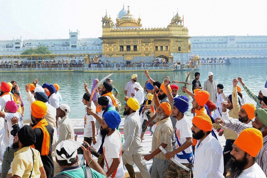 Sikh youth flash swords and raise slogans about Khalistan while taking a round of the Golden Temple in Amritsar on the occasion of anniversary of Operation Bluestar in 2015. Credit: PTI