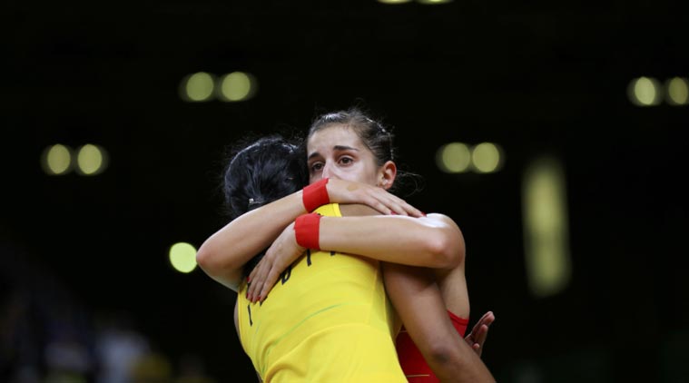 Carolina Marin of Spain hugs PV Sindhu of India after winning the gold medal match in the Rio Olympics. Credit: Reuters