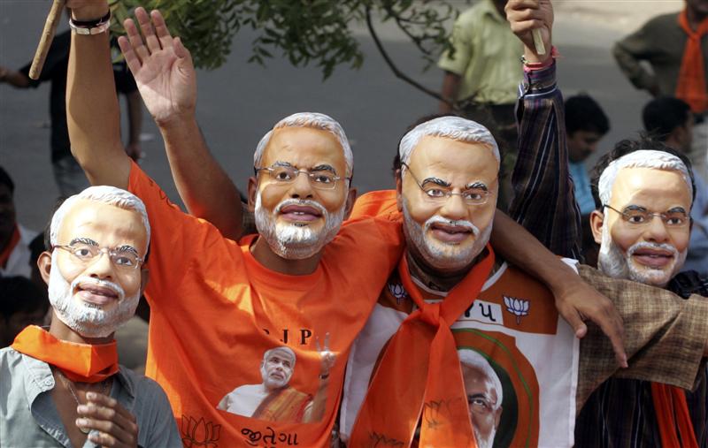 Supporters of Bhartiya Janta Party wear Narendra Modi masks in Ahmedabad, December 23, 2007. Credit: Reuters/Amit Dave/Files