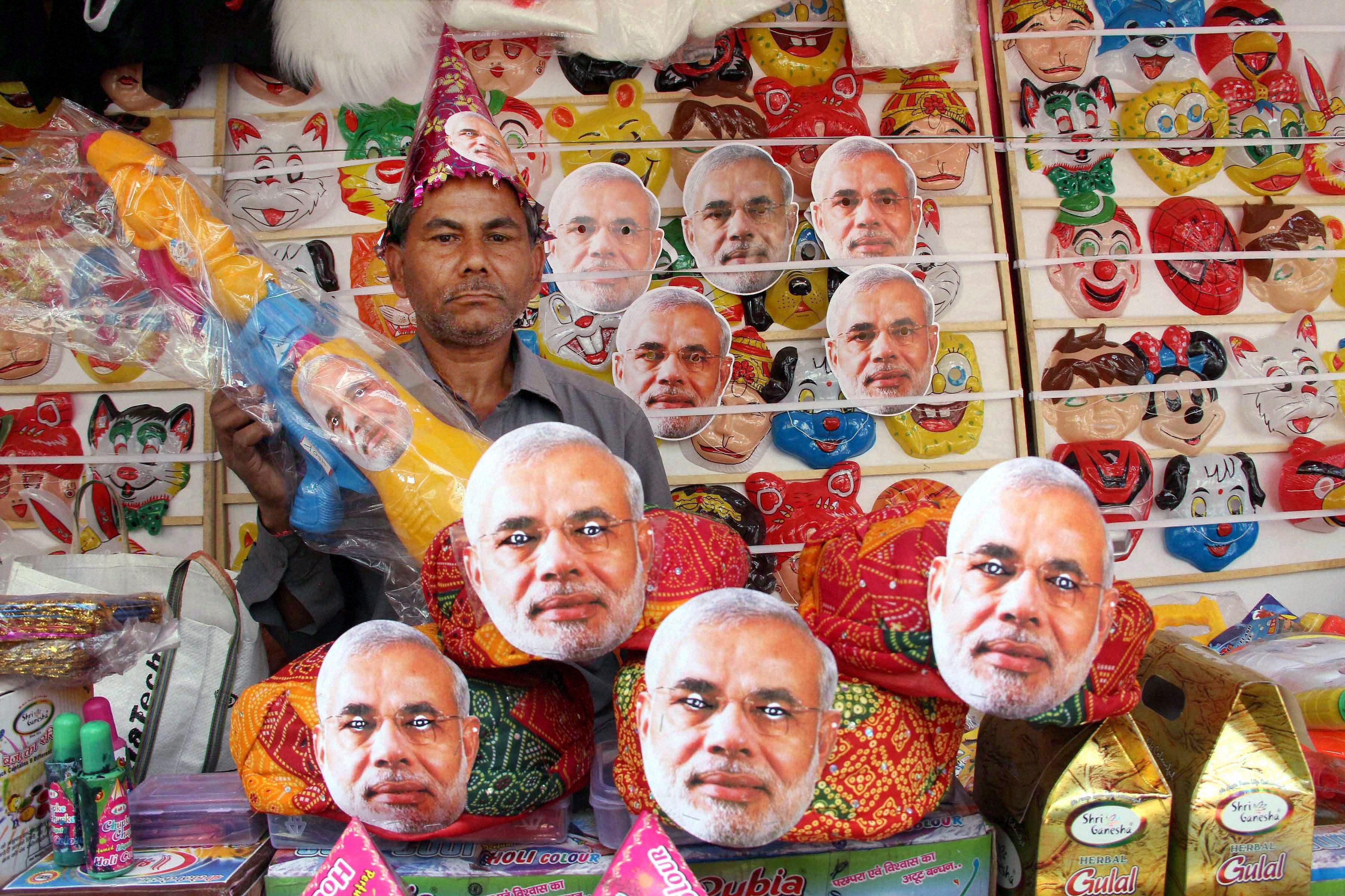 A vendor arranges masks of Prime Minister Narendra Modi at his shop in Ranchi. Credit: PTI/Files