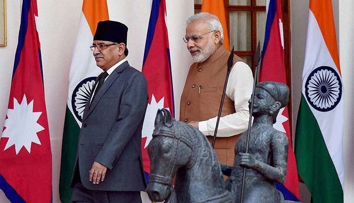 Leader of CPN-Maoist and former Prime Minister of Nepal Pushpa Kamal Dahal (left) with Prime Minister Narendra Modi. Credit: Reuters