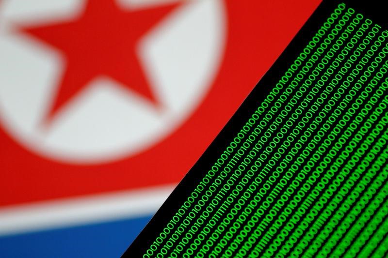 Binary code is seen on a screen against a North Korean flag in this illustration photo November 1, 2017. Credit: Reuters /Thomas White/