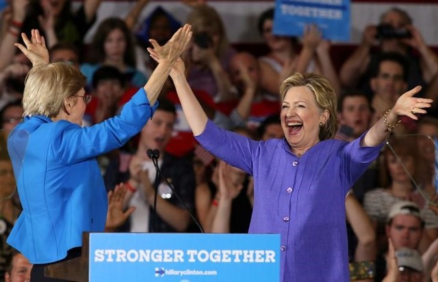 democrat elizabeth warren cheers for clinton  attacks trump on campaign trail