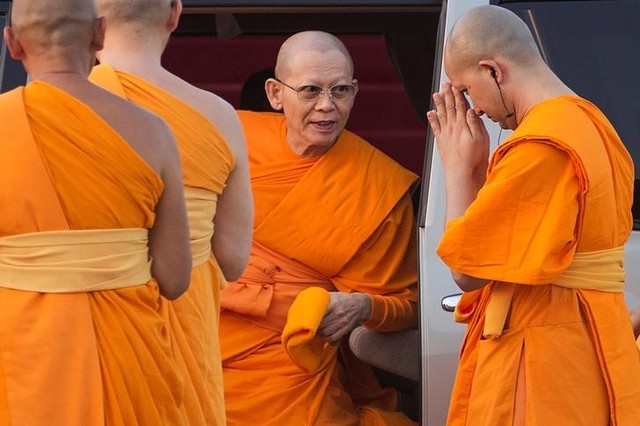 devotees in thailand shield corruption accused buddhist abbot from police