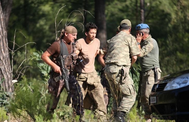 turkish crackdown grows  troops look for remaining plotters