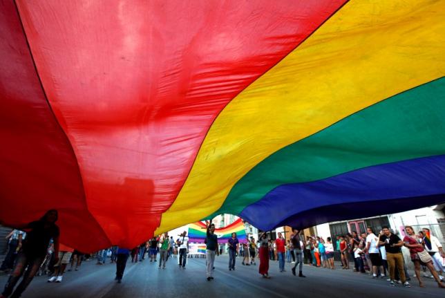 Participants carry a rainbow flag during an annual Gay Pride Parade along the streets of Ciudad Juarez, Mexico June 19, 2016. Credit: Reuters/Jose Luis Gonzalez
