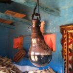 In Pachkol, a supposedly electrified tribal village in Chhindwara, Madhya Pradesh, a bulb works as an improvised kerosene lamp, a wick in place of the filament. Adivasis and dalits still matter the least when it comes to the provision of even basic facilities like household ownership, electricity, latrines and water connections. Credit: Nikhil M. Babu/IndiaSpend
