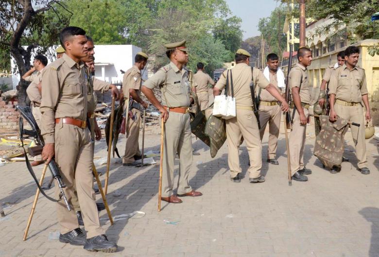 mathura police arrest four cops for allegedly assaulting rss leader