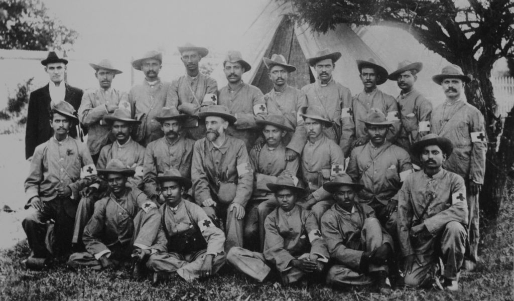 Mahatma Gandhi with the stretcher-bearers of the Indian Ambulance Corps during the Boer War, South-Africa. Credit: Wikimedia Commons