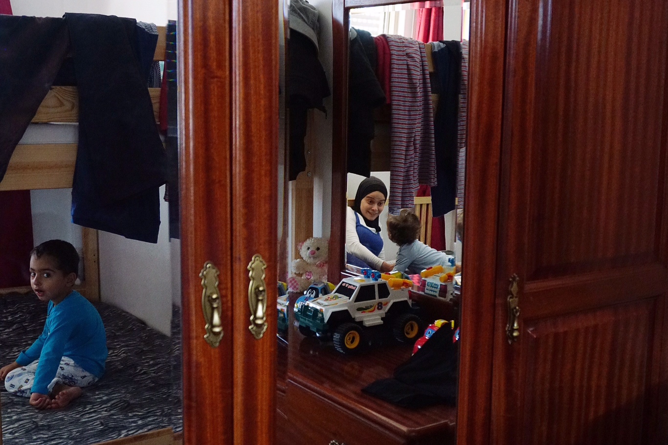 Ivan and Lokman on their bunk bed in Lisbon. Credit: Shome Basu