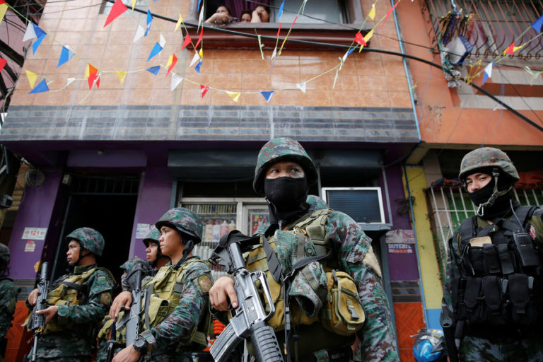 Armed security forces take a part in a drug raid in Manila. Credit: Damir Sagolj/Reuters/Files