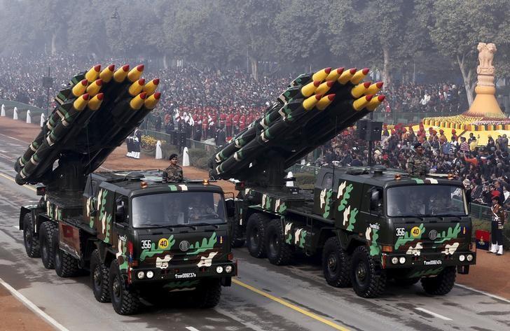 Indian army officers stand on vehicles displaying missiles during the Republic Day parade. Credit: Reuters