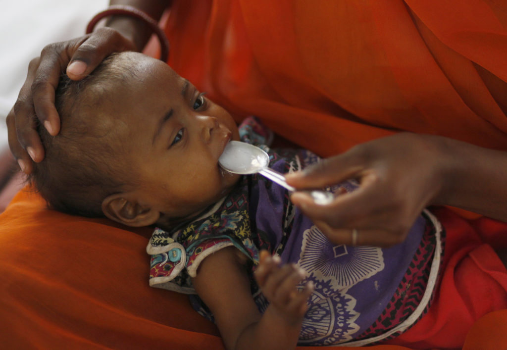 A mother feeds her malnourished child in the Nutritional Rehabilitation Centre of Sheopur district in the central Indian state of Madhya Pradesh. Credit: REUTERS/Reinhard Krause 