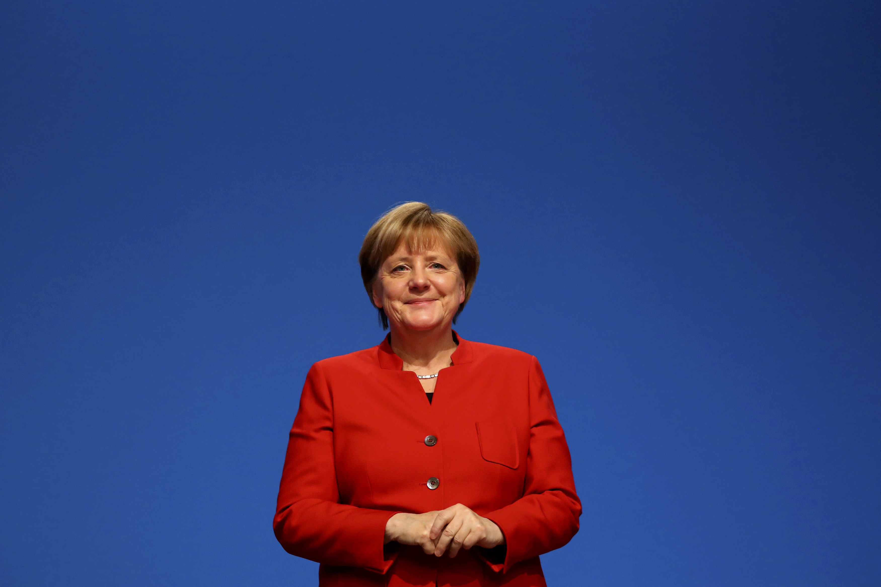 merkel toughens stance on immigration as she announces bid for fourth term