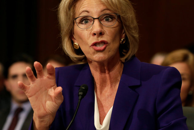 pence breaks tie to confirm devos as us education secretary