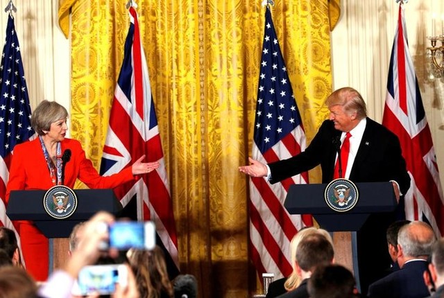 theresa may faces criticism for  special relationship  bid with us