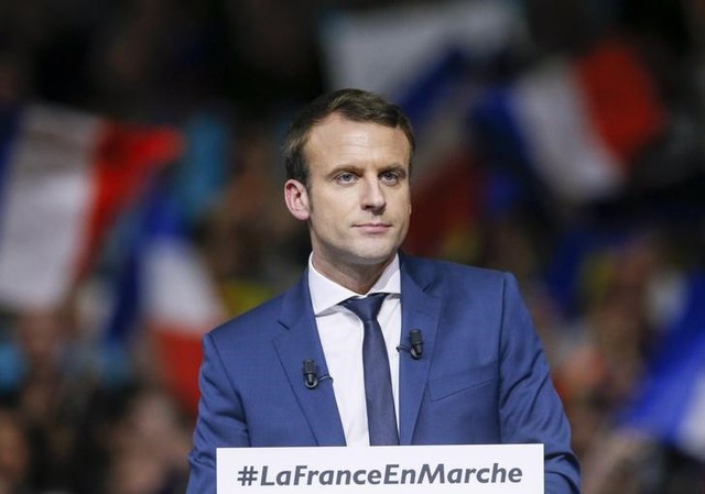 macron attacks le pen as french front runners campaign in lyon