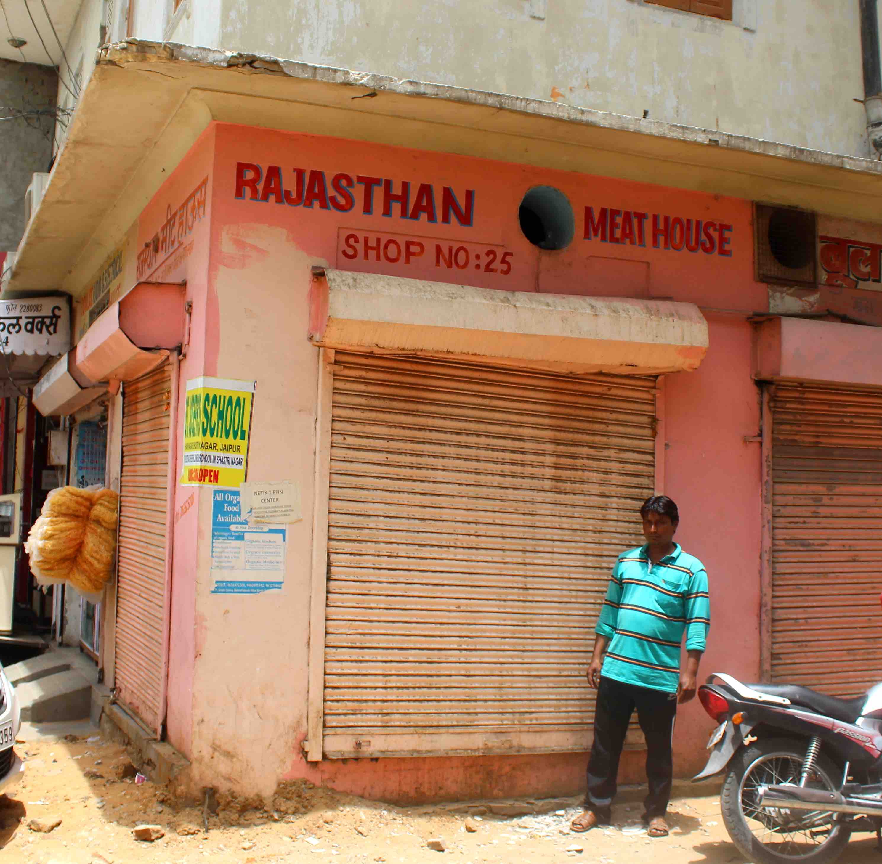 Riyazuddin Qureshi outside his sealed meat shop in Sindhi colony. Credit: Shruti Jain