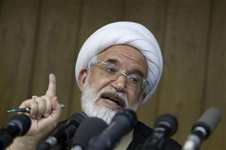 iran s president rouhani to get opposition figure karoubi s vote in election