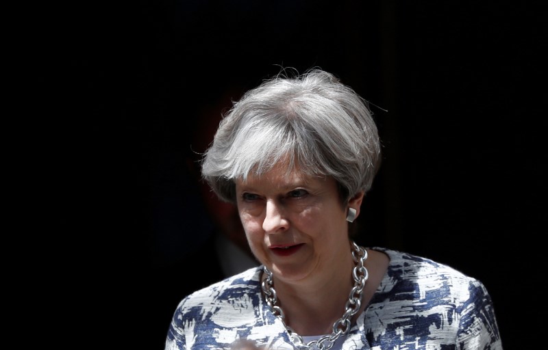 pm may unveils proposal to protect benefits of eu citizens living in uk