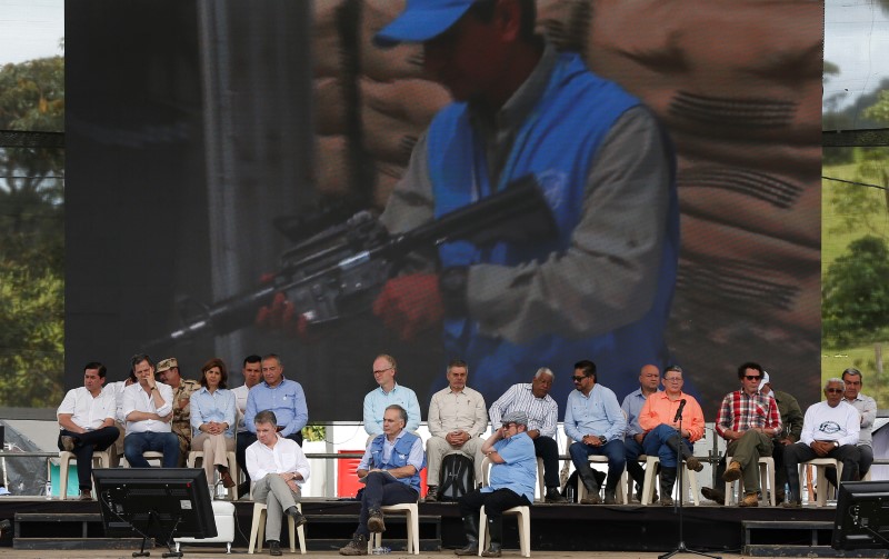 colombia s farc rebels hand over weapons  ending armed war with government
