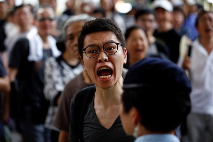 china s xi takes tough stance on hong kong amidst mass calls for democracy