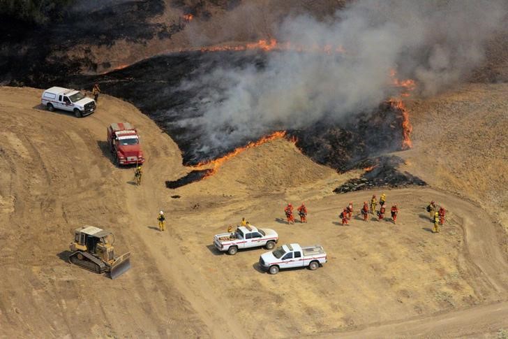 firefighters try to regain control of huge california wildfire