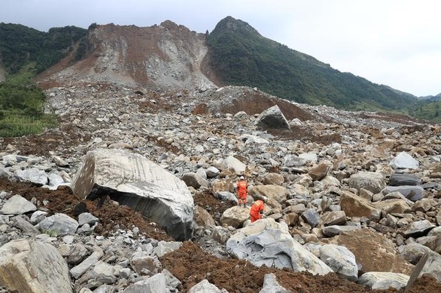 two killed as mountain collapses on township in south west china