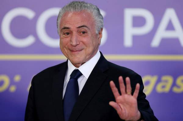 brazil s temer wins congressional votes to beat corruption charge