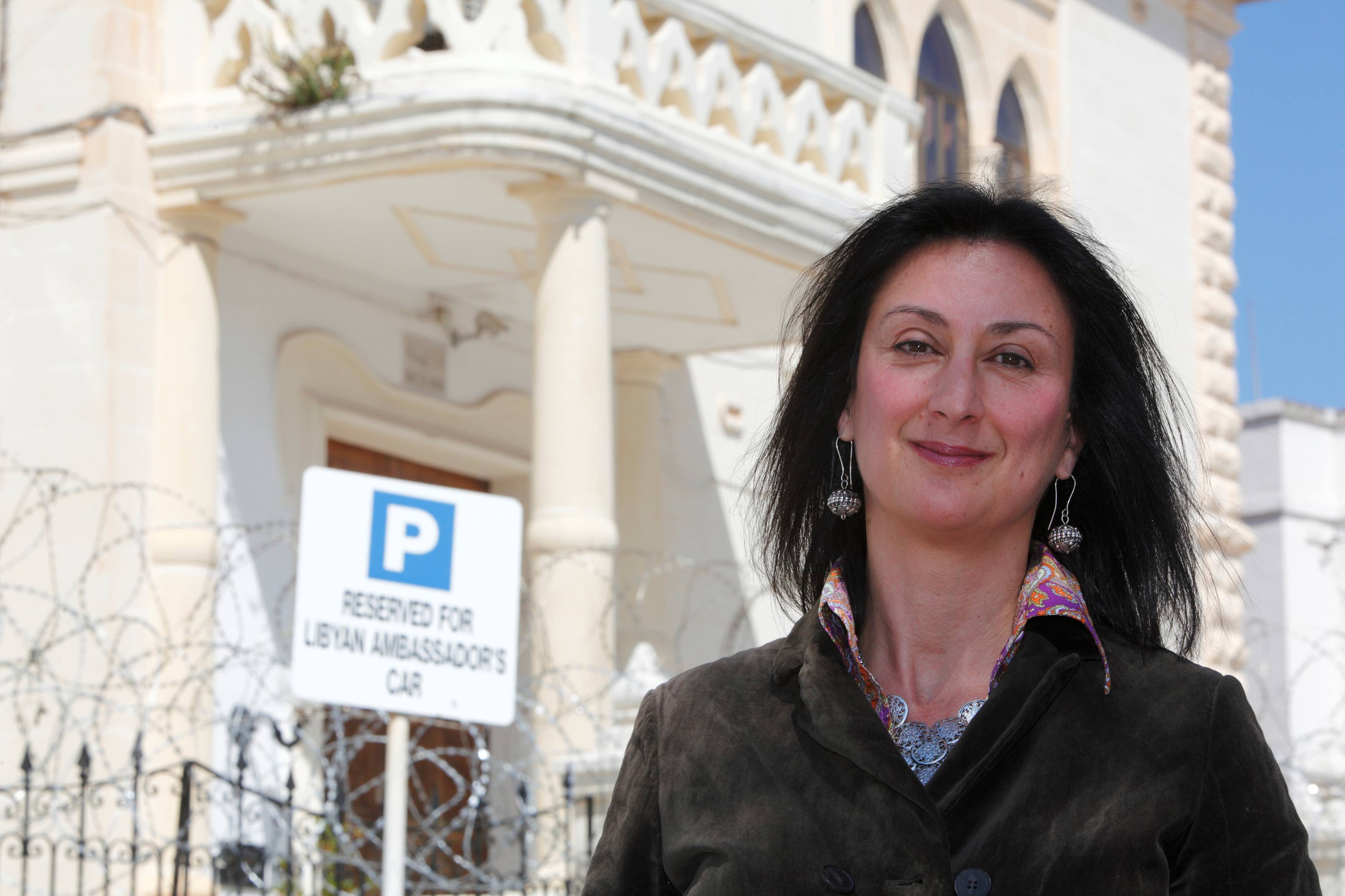 Maltese investigative journalist Daphne Caruana Galizia poses outside the Libyan Embassy in Valletta April 6, 2011. Investigative journalist Caruana Galizia was killed after a powerful bomb blew up a car killing her in Bidnija, Malta, in October 16, 2017. Picture taken April 6, 2011. Credit: Reuters/Darrin Zammit Lupi