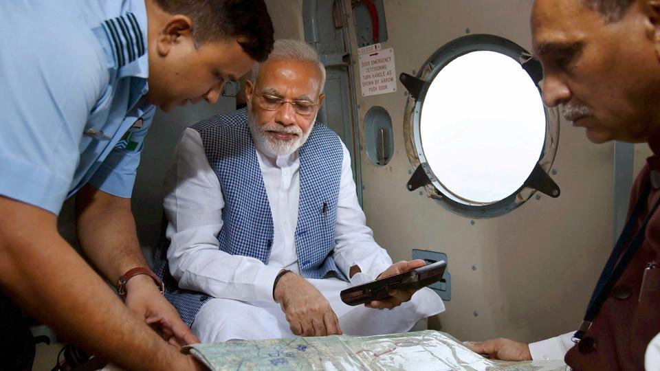 Prime Minister Narendra Modi with Gujarat chief minister Vijay Rupani during an aerial survey of flood-affected areas of Banaskatha district of Gujarat in July. Credit: PTI