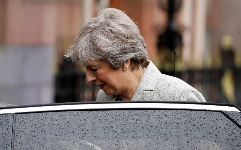 under fire  pm may stresses she can steer britain through brexit