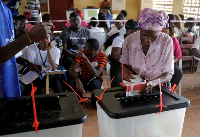 A woman casts her ballot during presidential elections at a polling station in Monrovia, Liberia, October 10, 2017. Credit: Reuters