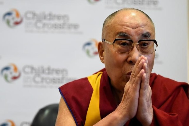 Tibetan spiritual leader the Dalai Lama, Patron of Children in Crossfire, gestures during a press conference in Londonderry, Northern Ireland September 11, 2017. Credit: Reuters