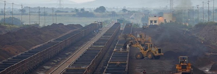 Freight trains are loaded with iron ore at a railway station at Chitradurga in Karnataka November 9, 2012. REUTERS/Danish Siddiqui/Files