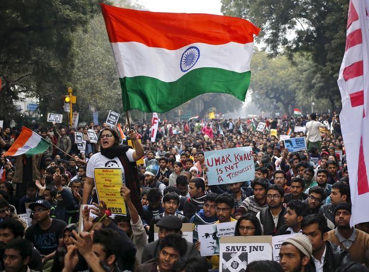 A demonstrator shouts slogans and waves the Indian national flag as she takes part in a protest demanding the release of Kanhaiya Kumar, a Jawaharlal Nehru University (JNU) student union leader accused of sedition, in New Delhi, India, February 18, 2016. Credit: Reuters